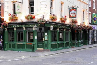 London, England, Great Britain, Europe, Traditional British pub façade with green painting and
