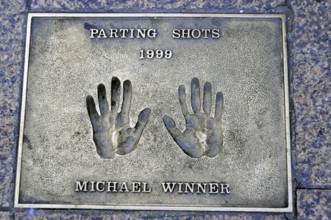 Memorial plaque with handprints and inscription for Michael Winner from 1999, London, England,
