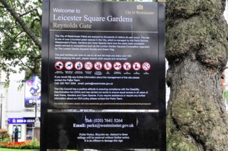 Information sign with park rules and prohibitions in Leicester Square Gardens, Westminster, London,