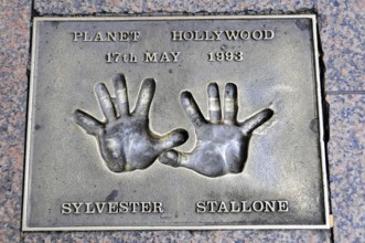 Sylvester Stallone's handprints for Planet Hollywood on a metal plate, London, England, Great