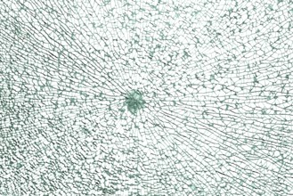 Full frame shot of a broken safety glass pane in white back