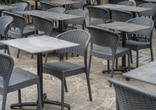Outdoor scenery with tables and chairs seen in Normandy, France