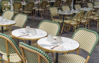 Outdoor scenery with tables and chairs seen in Normandy, France