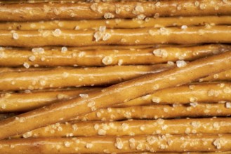 Closeup of some salt sticks in light back
