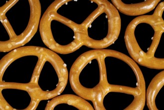 Closeup of some lye pretzels in dark back