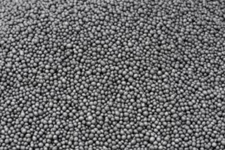 Full frame closeup showing lots of dark polystyrene beadlets