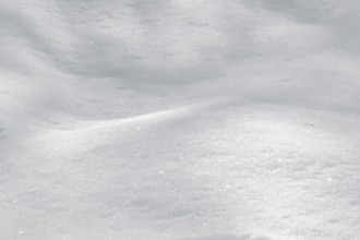 Detail shot of a white twinkling snow surface