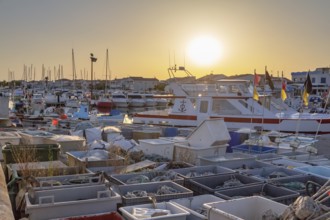 Harbor of Saintes-Maries-de-la-Mer, the capital of the camargue in the south of France at evening