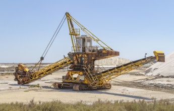 Bucket-wheel excavator near a salt production facility around Salin-de-Giraud located in in the