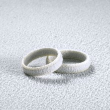 Studio photography of two frosted wedding rings in cold ambiance