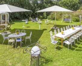 Sunny illuminated idyllic scenery showing a garden prepared for party