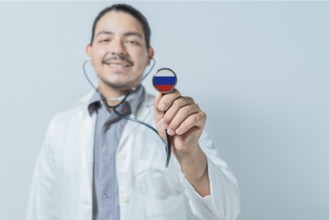 Smiling doctor showing stethoscope with Russia flag. Russia national healthcare