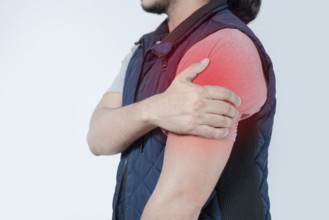 Unrecognizable person with shoulder pain on isolated. Person in pain with arm pain highlighted in