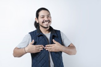 Smiling man with hands on chest on isolated background