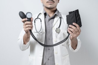 Doctor showing tensiometer on isolated