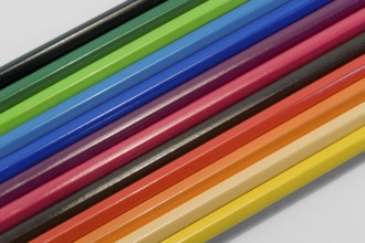 Detail shot of some colored pencils in light back
