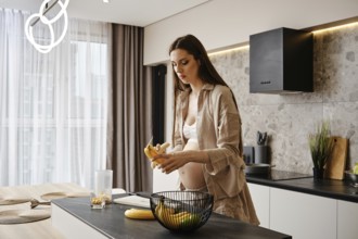 Pregnant woman preparing healthy snacks in modern kitchen with fresh fruits and natural light