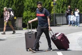 Tourist with suitcase, Interlaken, Switzerland