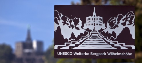 Bergpark Wilhelmshöhe, sharp sign and blurred original building, Kassel, Hesse, Germany