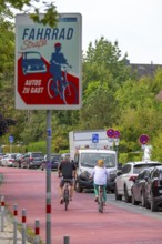 Cycling in Münster, cycle lane, Goldstraße, red asphalt and pictograms indicate to motorists that