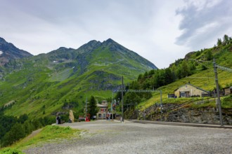 Railroad Station Alp Grüm with Mountain View in the Swiss Alps in a Cloudy Day with Sunlight in