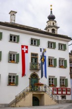 Beautiful City Hall with Swiss and Canton Flag in a Summer Day in Samedan, Grisons, Switzerland