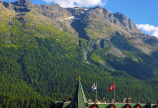 Beautiful Luxury Hotel with Swiss and Grisons and Flag Blue Sky and Mountain in the Swiss Alps in a