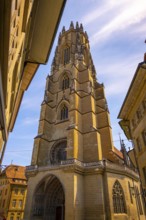 Cathedral Entrance Door and with Tower in Old Town Medieval in a Sunny Summer Day in Fribourg,