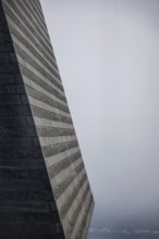 Modern Granite Wall in the Fog with Sunlight in Switzerland
