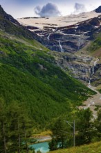Beautiful Mountain Alp Grüm with Glacier and Alpine Lake Palü in the Swiss Alps in a Sunny Cloudy