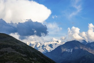 Beautiful Aerial View over Swiss Alps with Glacier in a Sunny Day and Clouds over St Moritz,