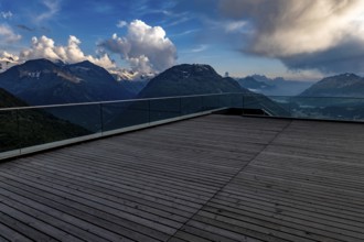 Beautiful Terrace View with Snow and over Alpine Lake and Swiss Alps and Cityscape in a Sunny Day