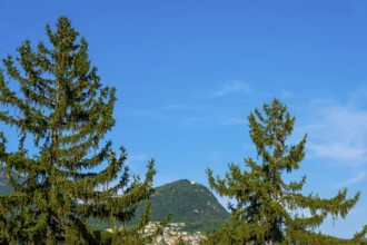 Mountain Bre and Village on Mountain Peak in the Swiss Alps and Blue Sky in a Sunny Summer Day in