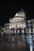 Beautiful Bundeshaus Illuminated Parliament Building or Federal Palace with Water Fountain on