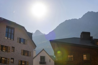 Beautiful Modern Building Against Blue Clear Sky and Mountain in a Sunny Summer Day with Sunlight