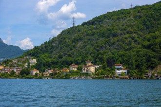 House and Mountain Range in a Sunny Summer Day on the Waterfront to Lake Lugano in Figino, Lugano,