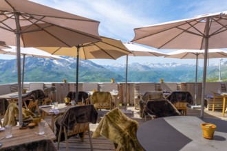 View From a Restaurant Terrace with Parasol and with Mountain Peak in the Swiss Alps and Sky in a