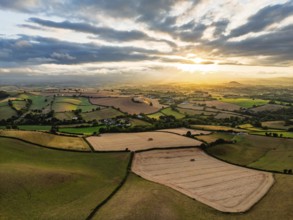 Sunset of Fields and Farms over Devon from a drone, Torquay, Torbay, Devon, England, United Kingdom