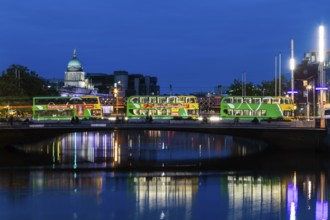 Buses on a bridge over the River Liffey, blue hour, Dublin, Ireland