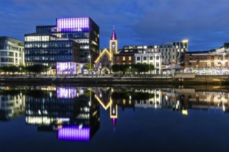 Office building and church reflected in the River Liffey, blue hour, Dublin, Ireland