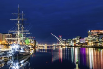Sailing ship, behind the Samuel Becket Bridge, night shot, Dublin, Ireland