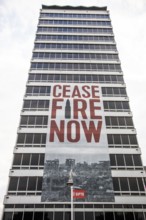 Appeal for peace and ceasefire, poster on a tower block, Dublin, Ireland