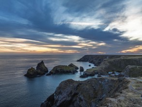 Sunset over Kynance Cove from a drone, Mount's Bay, Lizard Point, Cornwall, England, United Kingdom