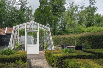 Small greenhouse in a garden, province of Groningen, Netherlands