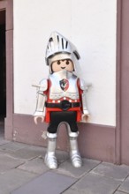 Ettlingen, Germany - August 13th 2025: Large Playmobil knight toy figurine displayed in street