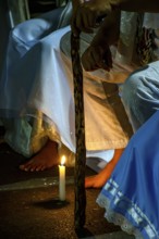 Moment of prayer illuminated by candles in a religious ceremony of Umbanda, Belo Horizonte, Minas