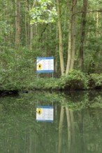 Entrance to the national park, information sign, trees, reflection, canal Alte Fahrt between Bolter