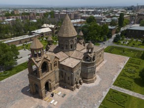 Close-up of a historic church with detailed architecture in urban surroundings, aerial view,