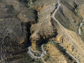 View of hilly landscape with clearly visible unpaved roads, aerial view, Angel's Canyon, canyon,