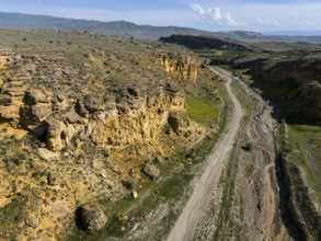 Geological formations along a dirt road in a barren landscape, aerial view, landscape at Angel's